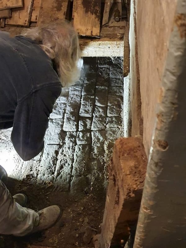 Tony working at the entrance to the tunnel in the Room of Doom