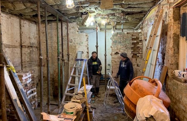 Kitchen looks cluttered but in twenty minutes would be ready for the contractors