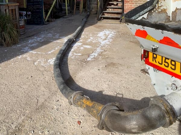 The hose from the pumping lorry into The Kitchen area