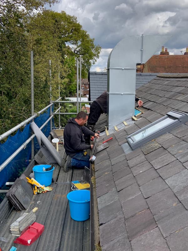 Shane and Dale attaching the new top to the extraction unit