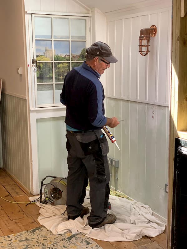 John re-instating the wood panelling