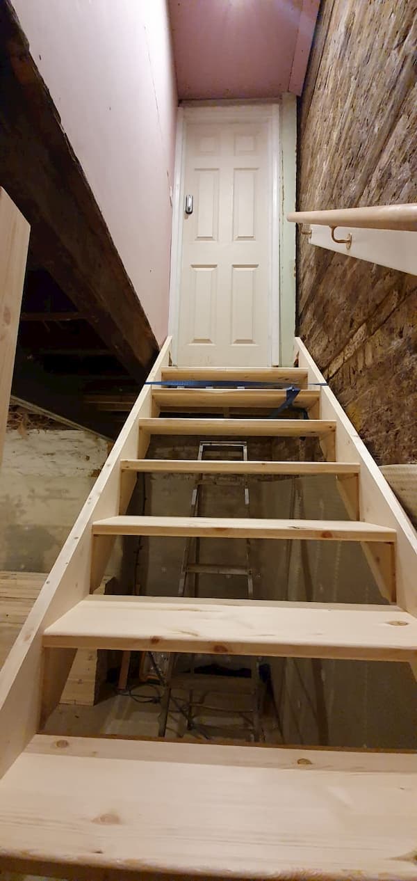 Top of the stairs leading up to The School House door