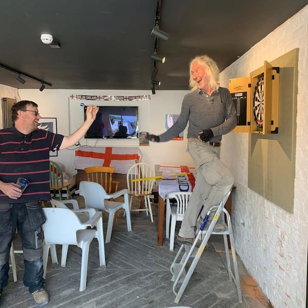 The lads having a bit of fun at the dartboard