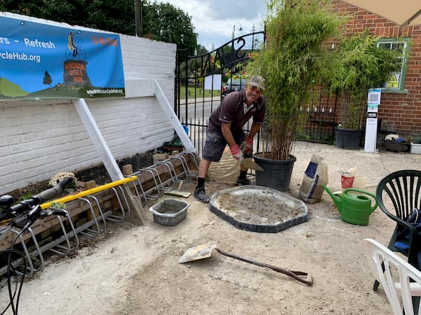 Johnmixing more concrete for the new flower bed