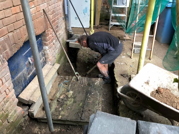 Lots of careful digging due to pipes and brickwork.