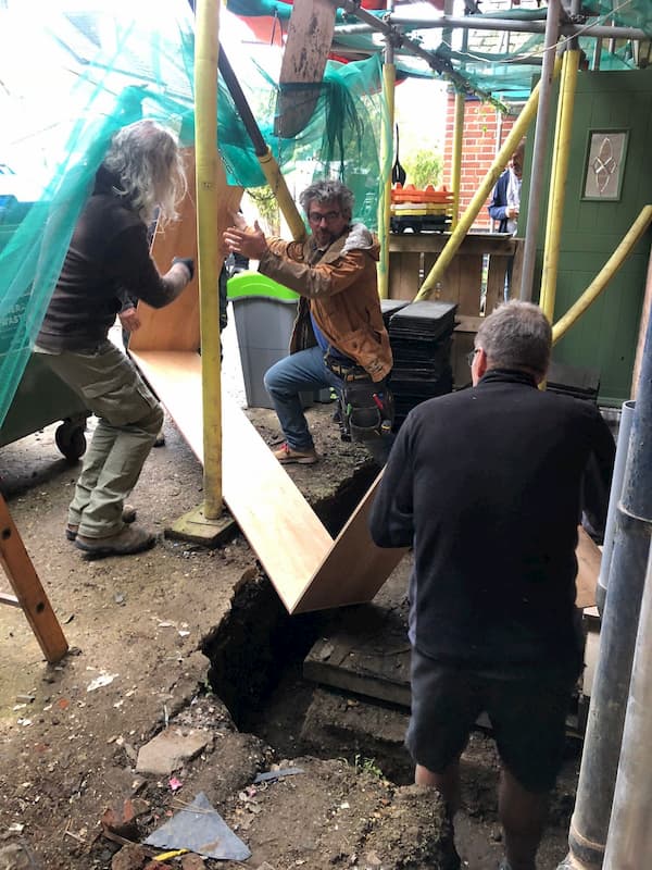 The wooden frame to be used for concreting round the cellar door.