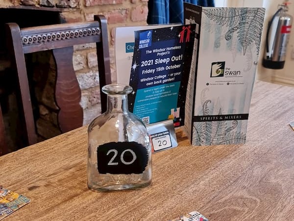 Table inside The Bar: bottle for candle and menus, etc on top