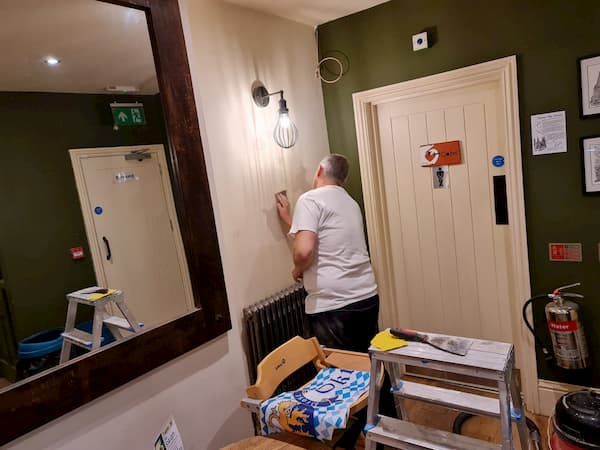 Barry prepping a wall in The Bar