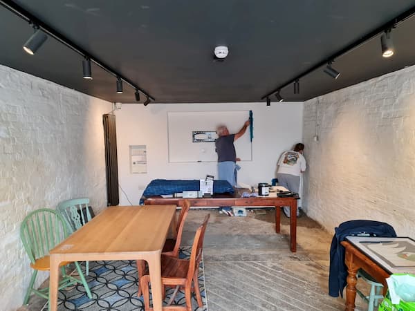 Liz and Ken painting in The Coach House