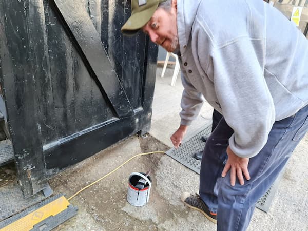 Aidan touching up The Coach House doors