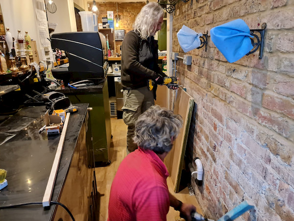 Thomas and Tony working on the two ends of the counter top.