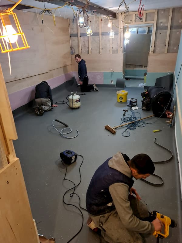 The team working on The Kitchen floor