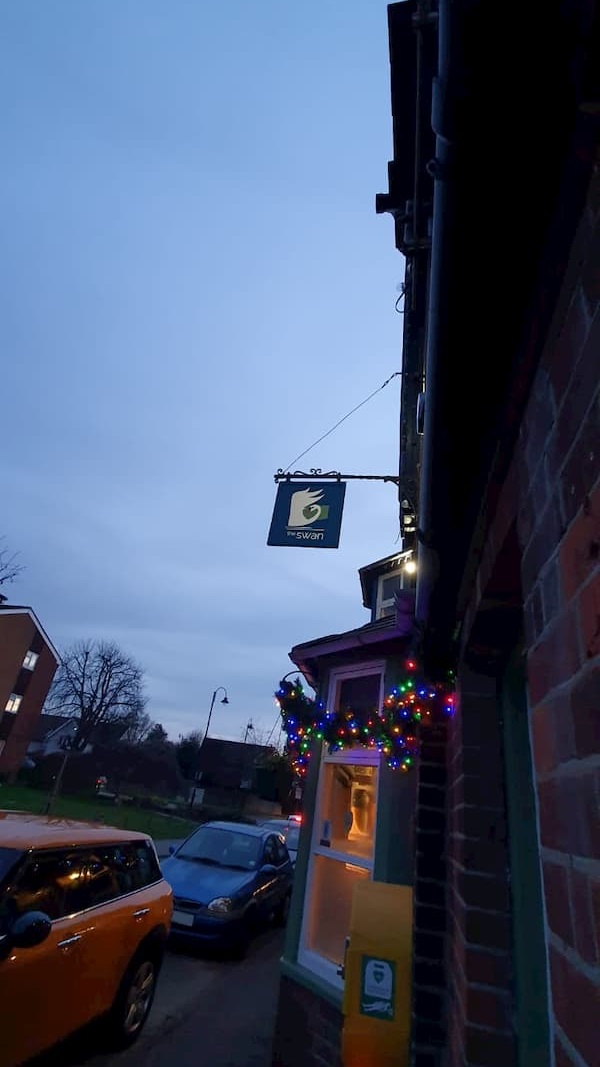 Dusk facing south, the sign is starting to show up