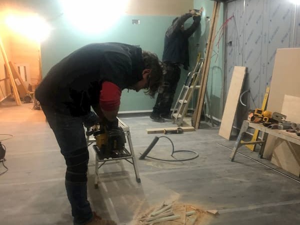 Thomas using power tools in The Kitchen