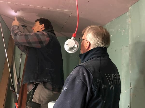 Ian and Richard fireboarding the ceiling in The Coldroom