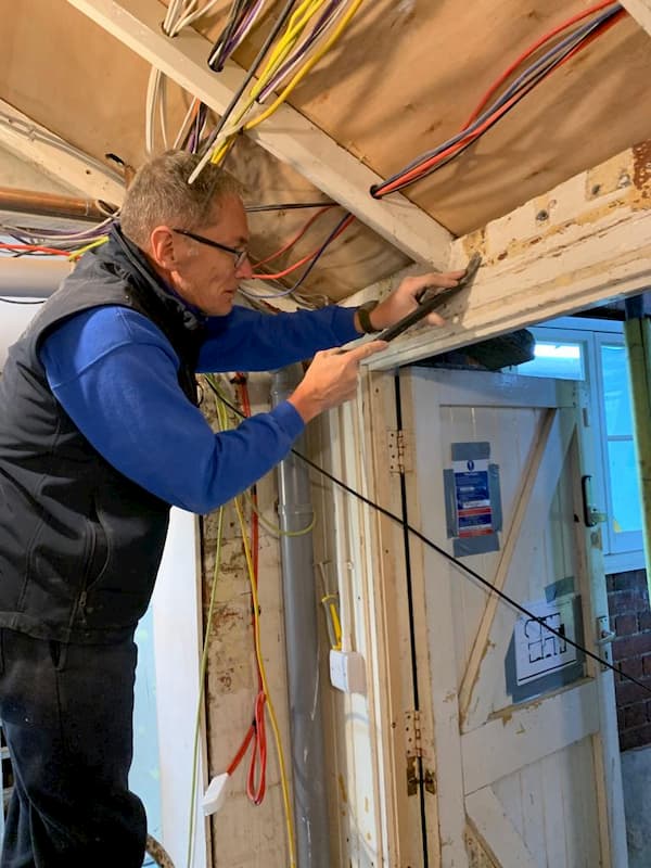 Trevor fixing the lean-to in the corridor