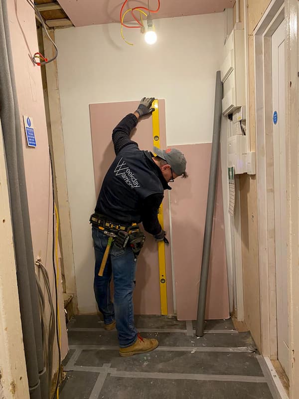 Thomas measuring up fireboard ready for cutting