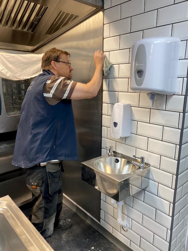 Ian clearing some grout of the aluminium 