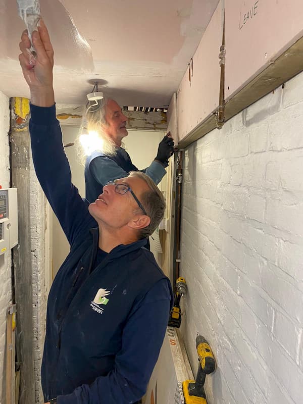 Trevor painting the ceiling