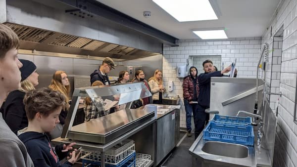 The students listening to the team from McFarlane Telfer in The Kitchen