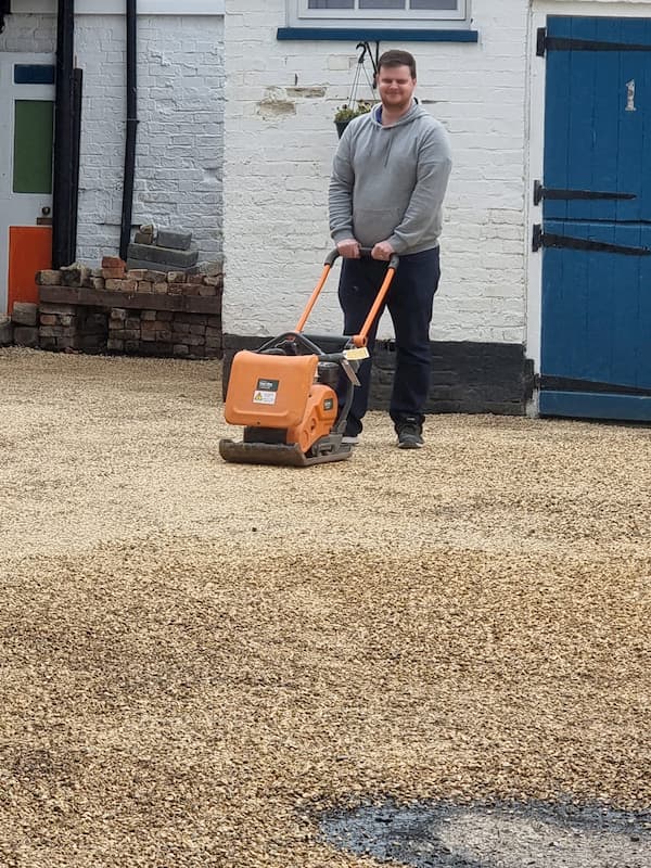 Micky using the tamper machine