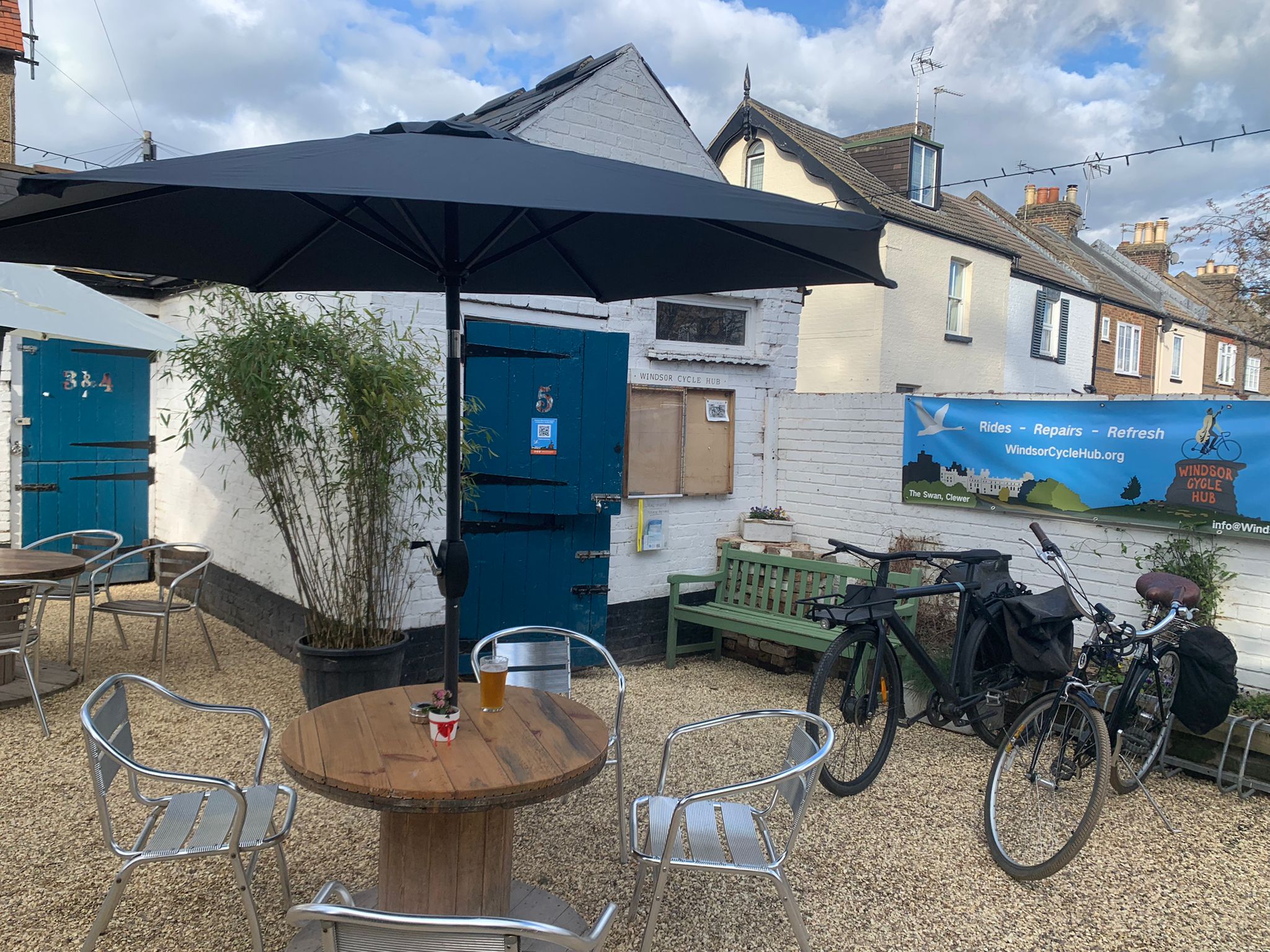 Tables out, bikes parked up, plants back