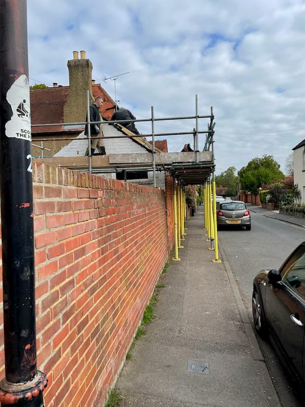 Scaffolding extending out into street from The Stables.