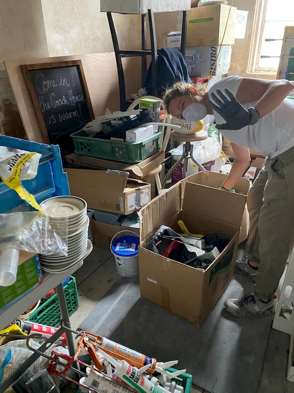 Storing away tools in one of the stables.