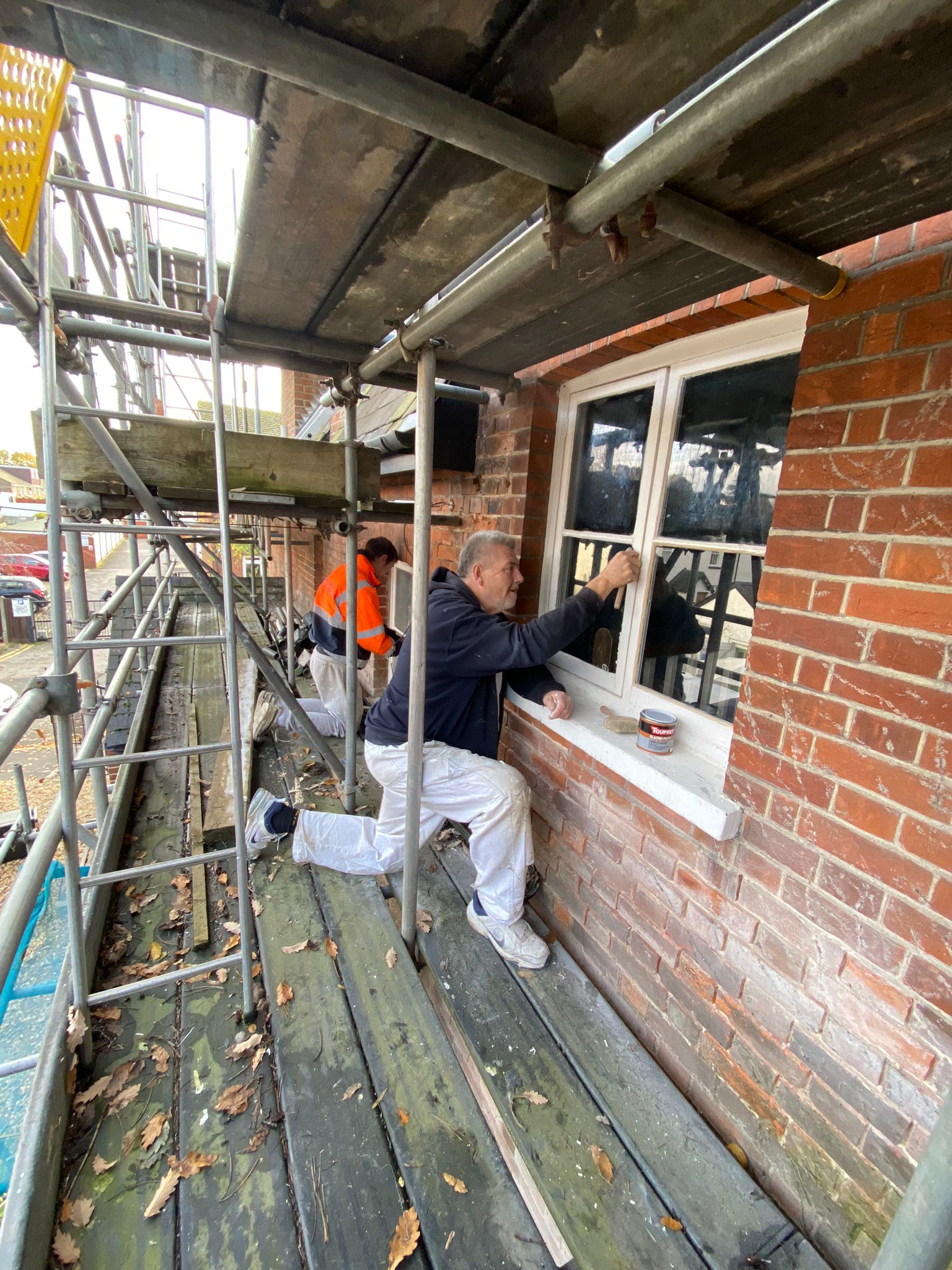 Painting the windows on the first floor