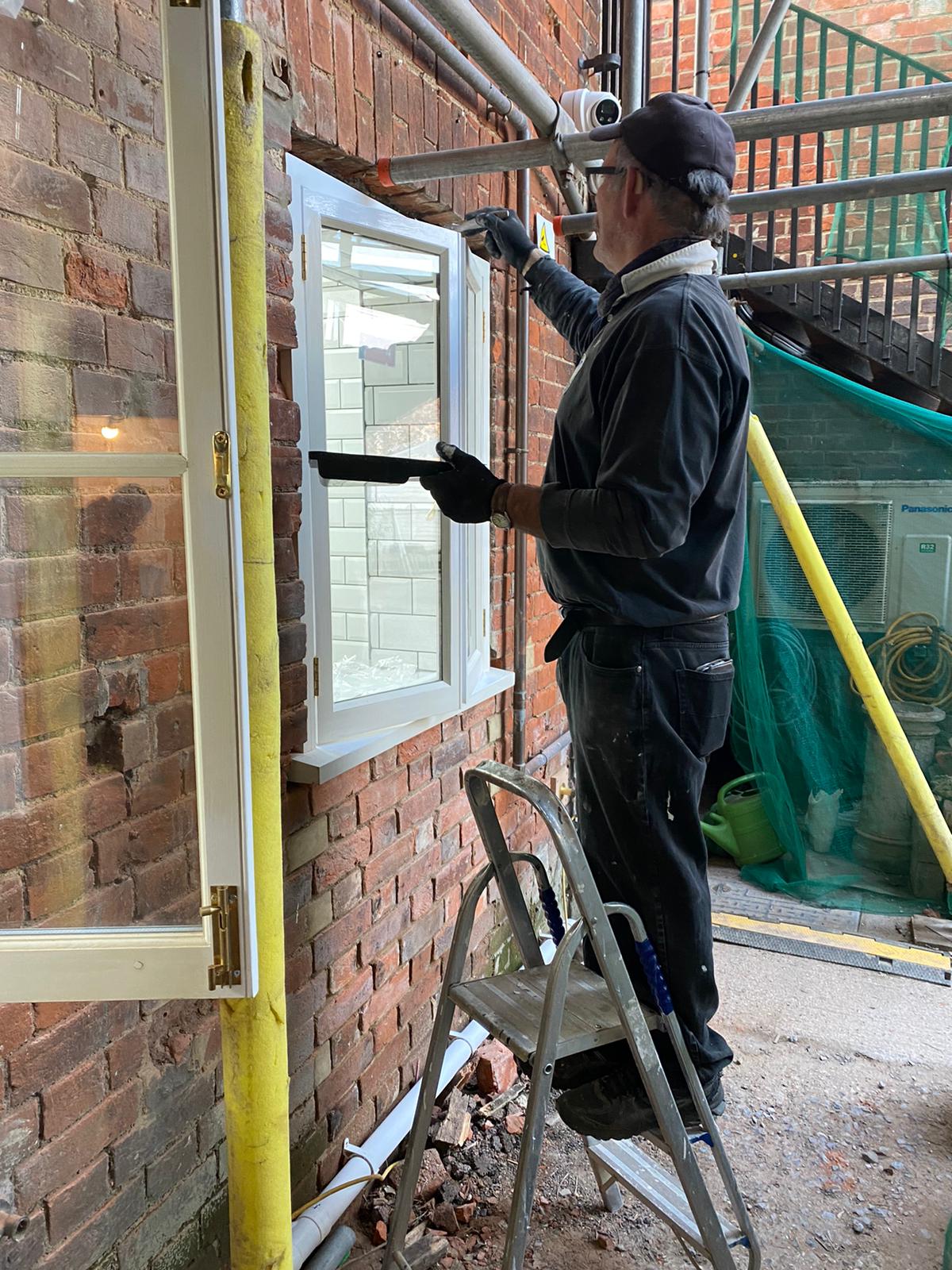 Another shot of John painting the new window fitted last week