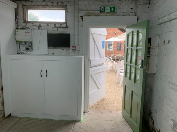 Inside stable 5 with new security door and all the electrics boxed in