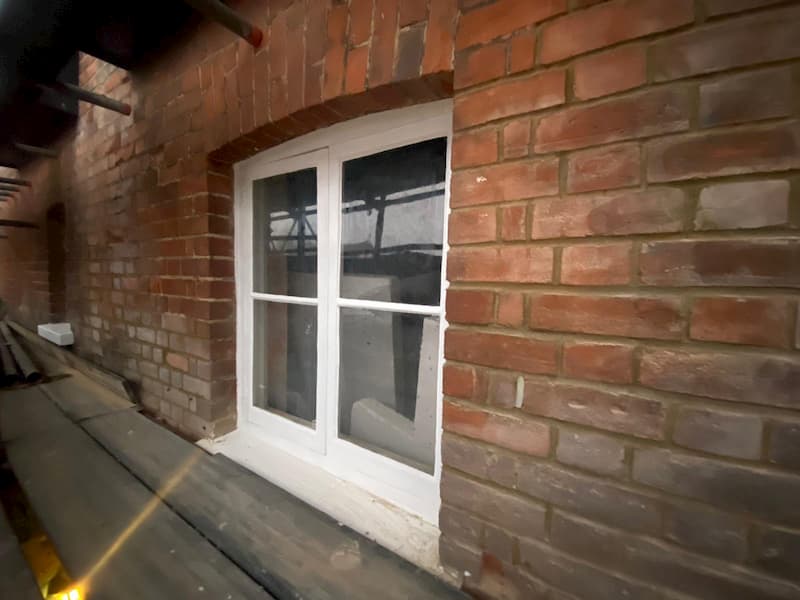 Window on first floor repainted with surrounding brickwork repointed.