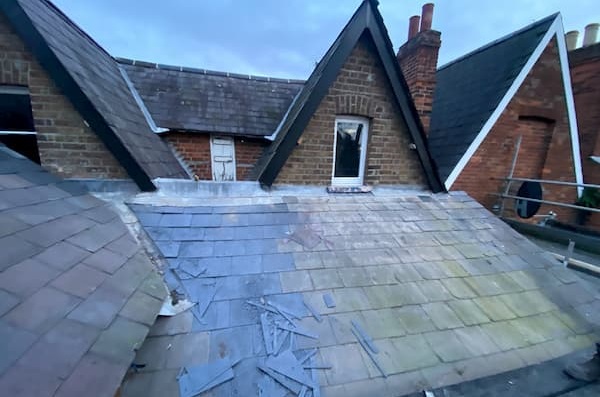 New slates in place on one section of the roof.