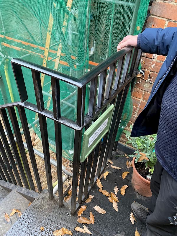 Additional piece of hand rail has been welded on at the top of the iron stairs.