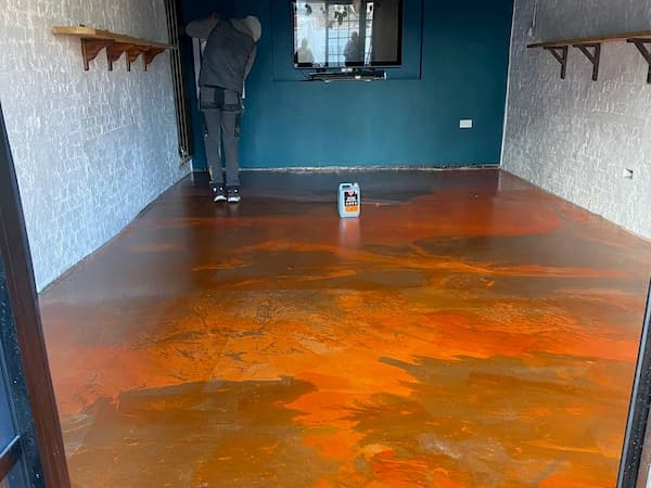 The floor of The Coach House is an orangey red colour.