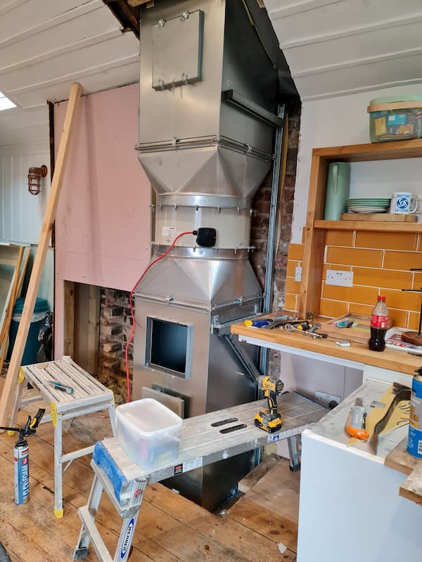 Ventilation unit which comes from The Kitchen fully stripped back and ready for sound insulation.