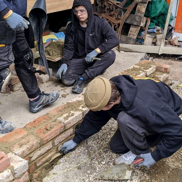 Three of the students just completing the third course