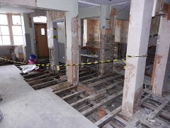 Wider view of the pub, a lot of floor boards have been removed