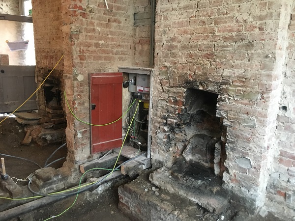 Exposed fireplace in the main bar area