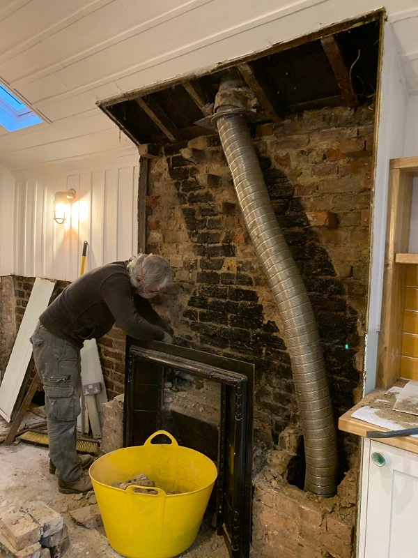 Tony prepping the chimney breast
