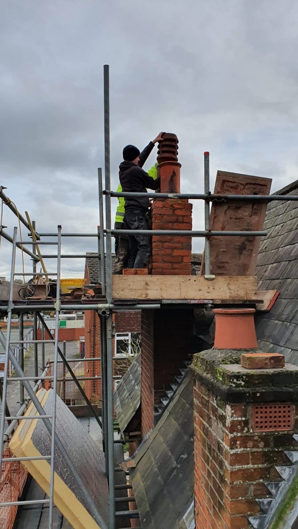 Stuart and casey working on the chimney