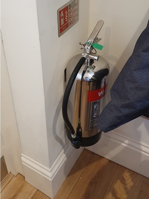 New fire extinguishers outside the ladies toilet