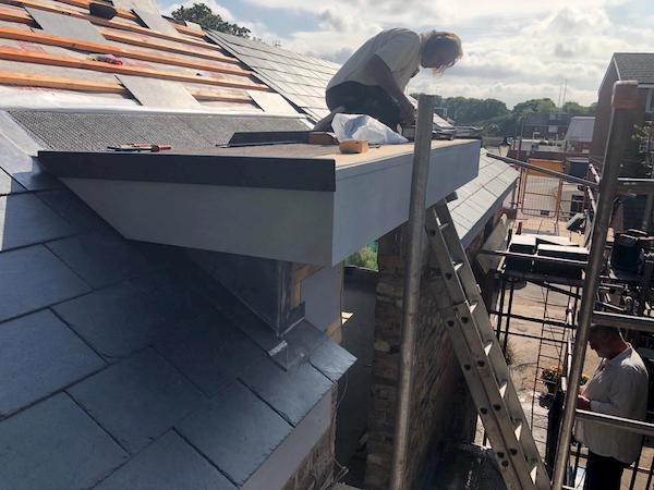 Tarring the roof above the coach house first floor door