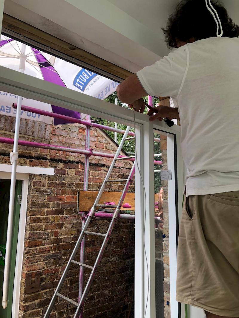 Putting in glass at the door frame