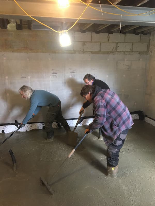 Churning the concrete using rakes