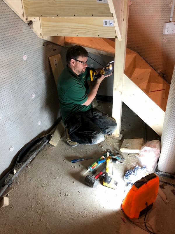 Ian working under the saircase where the tunnel entrance was purported to be