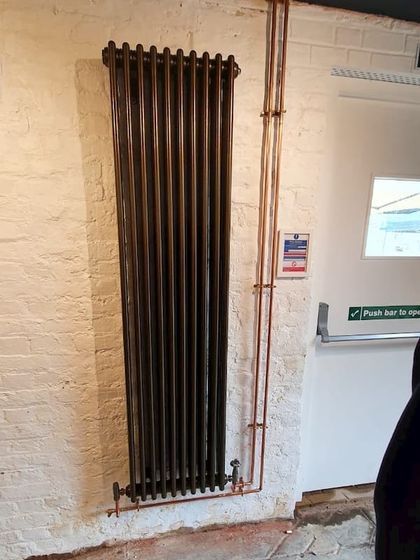 New radiator in The Coach House