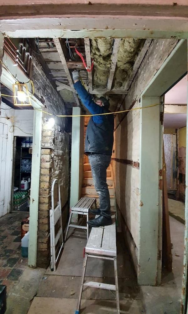 Insulating the ceiling in the corridor, The School House above, 24th January 200