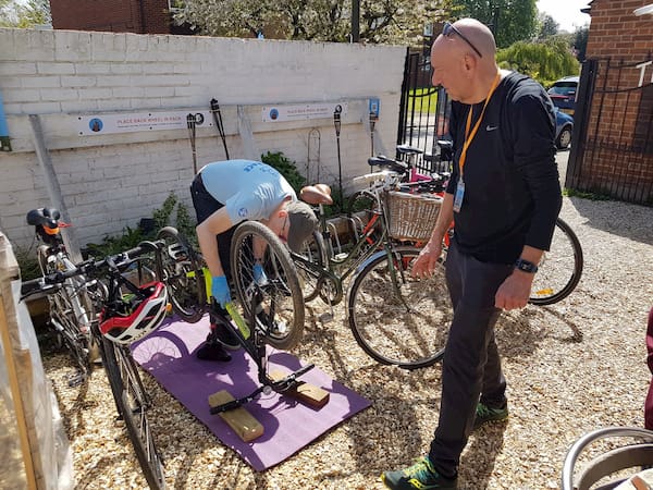 Volunteers working on a bike.