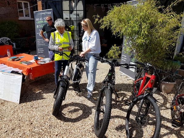 Two ladies looking over one of the new bikes.